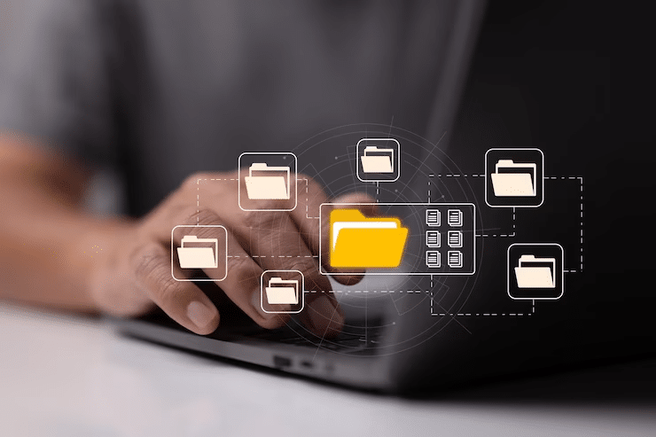 Person organizing digital files on a laptop