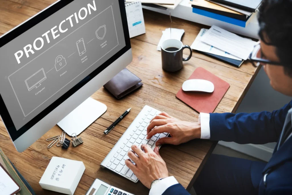 Office worker typing on computer about online protection